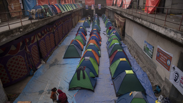 Donated tents to shelter women line the floor of a vacant commercial complex in New Delhi. Protesters have created camps around Delhi that are virtual cities unto themselves, using donations and their own organisational skills in their battle against new government farm policies.