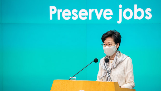 Carrie Lam, Hong Kong's Chief Executive, speaks while wearing a protective mask during a news conference in Hong Kong. 