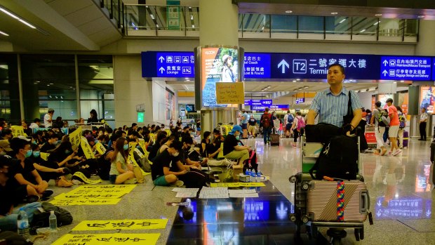 Demonstrators stage a protest at Hong Kong International Airport.