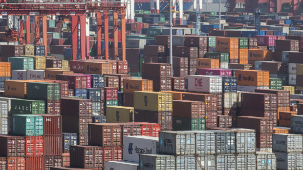 Containers sit stacked at the Yangshan Deep Water Port in Shanghai, China.