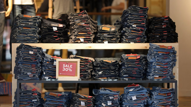 Global icon: Piles of jeans sit displayed for sale inside a Levi Strauss  fashion store in London. 