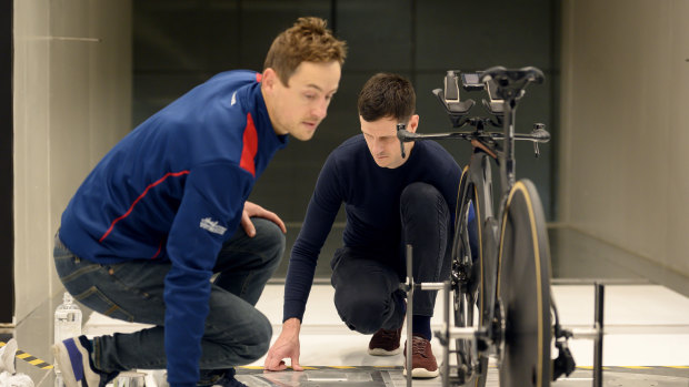 John Pitman, Head of Aerodynamics at the South Australian Sports Institute and sports scientist Ken Ballhause sets up for wind tunnel tests for  the new handle bars designed for Emily Petricola’s bike. 