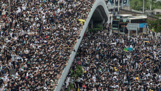 Protesters occupy a main road and walkways during a rally against a proposed extradition law in Hong Kong, China.