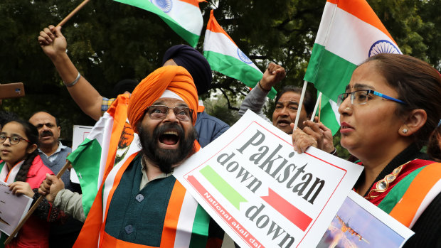 National Akali Dal leaders shout slogans in New Delhi as they celebrate the Indian Airforce bombing Pakistan territory on Tuesday, February 26.