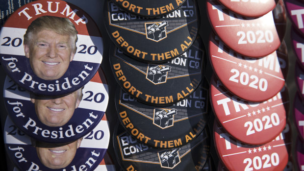 Campaign buttons are sold at a rally for US President Donald Trump in El Paso, Texas.