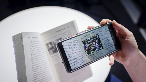 Readers use an augmented reality app to watch video content that is part of Khyiah Angel's novel I Know Why You Run.