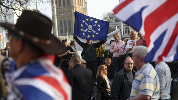 A pro-Brexit campaigner waves an anti-European Union flag.