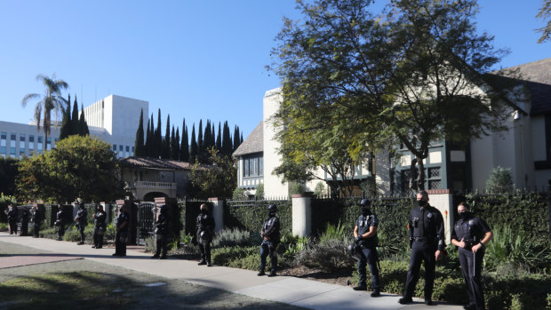 Police officers stand outside the home of Los Angeles Mayor Eric Garcetti during a protest in Los Angeles, California, US.