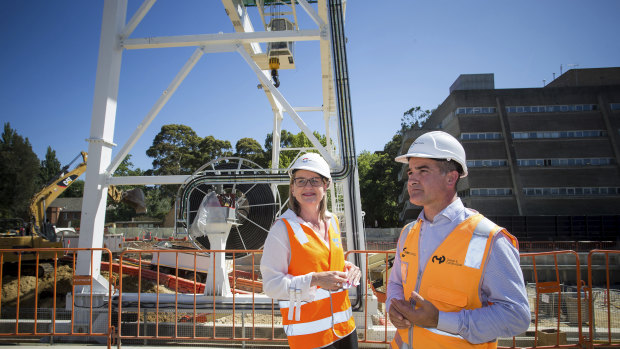 Acting Premier James Merlino and Transport Infrastructure Minister Jacinta Allen in January in front of a gantry crane in Parkville that has now been pulled down.