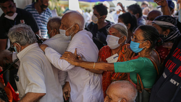 Elderly Indians queue at a vaccination centre in Mumbai.