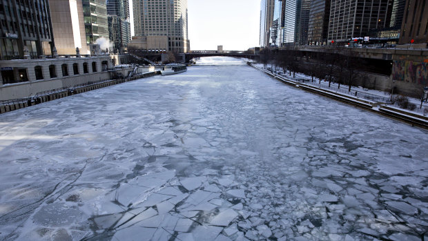 Ice floats on the Chicago River in Chicago on Wednesday.