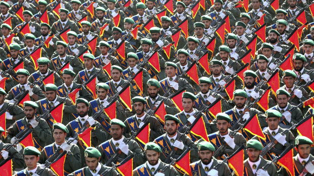 Iran's Revolutionary Guard troops march in a military parade in 2016.