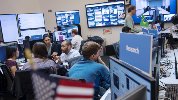 Employees work inside Facebook's "War Room" ahead of Brazil's run-off election in Menlo Park, California.