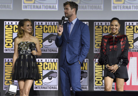 Promoting Thor: Love and Thunder: Natalie Portman with Chris Hemsworth and Tessa Thompson at the 2019 Comic-Con in San Diego.