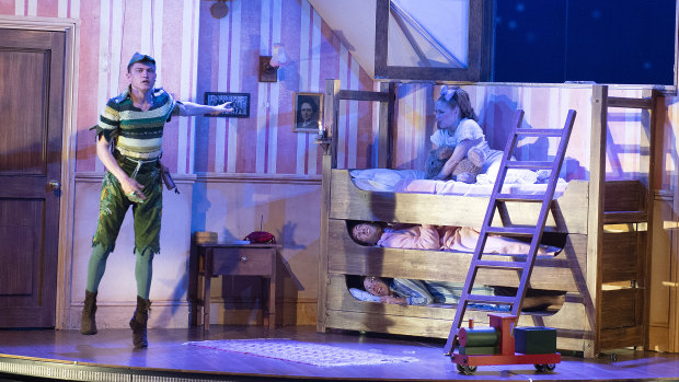 Darcy Brown, who plays Peter Pan flies into the nursery where (from top) Francine Cain, who plays Wendy, Jordan Prosser, who plays Michael and George Kemp, who plays John are in bed.