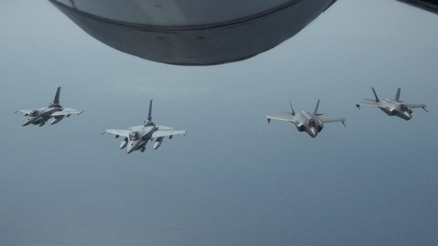 UAE Desert Falcons fly in formation with US F-35A Lightning IIs in an undisclosed location in south-west Asia. The flight was conducted to continue building military-to-military relationship with the UAE, according to the US Air Force.
