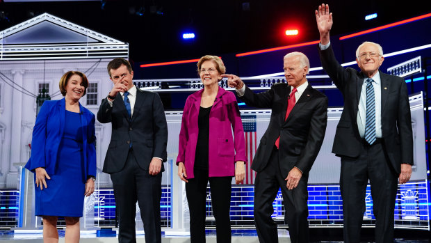 Presidential hopefuls from left: Amy Klobuchar, Pete Buttigieg, Elizabeth Warren, Joe Biden and Bernie Sanders stand on stage for the fifth Democratic presidential debate in Atlanta, Georgia.