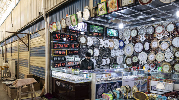 Clocks are displayed at a stall inside the main bazaar Xinjiang.