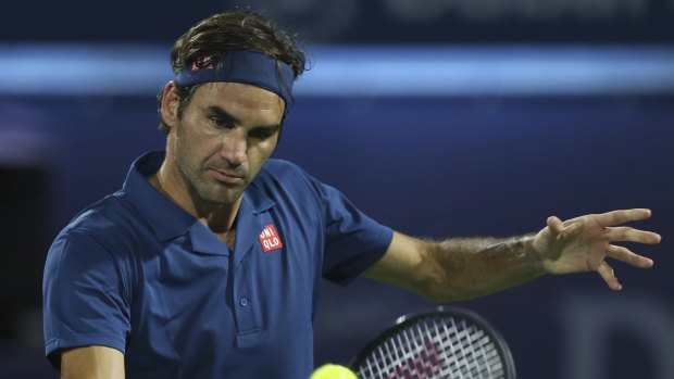 Controlled: Roger Federer made it through his first round in Dubai.