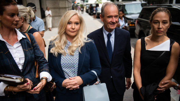 David Boies, representing several of Jeffrey Epstein's alleged victims, centre, arrives with Annie Farmer, right, and Virginia Giuffre,  alleged victims of Jeffrey Epstein in court in New York last year.