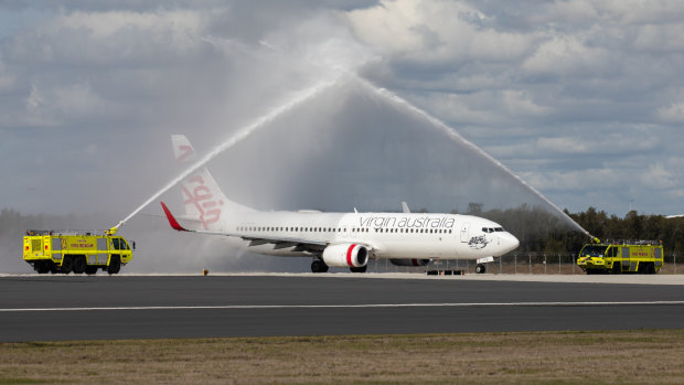 The first flight - Virgin 781 to Cairns - prepares to take off from Brisbane's new runway.