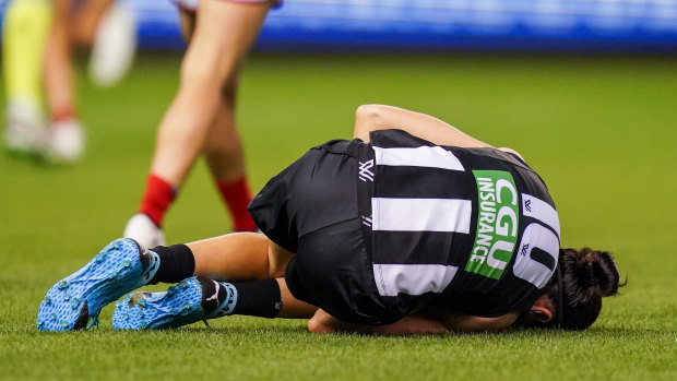 Down and out: Collingwood's Ashleigh Brazill.