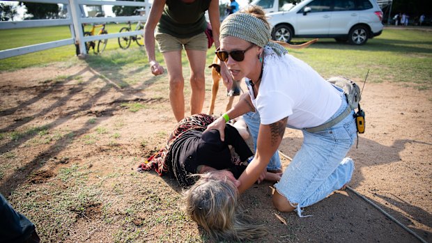 The 61-year-old NSW woman was left sprawled on the ground after being hit by the gate.