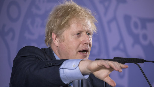 British PM Boris Johnson takes a question from the audience after delivering a speech on "Unleashing Britain's Potential" in London. 