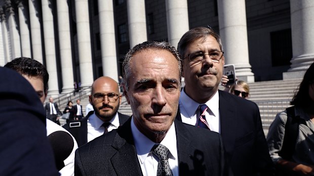 Representative Christopher Collins, a Republican from New York, exits federal court in New York.