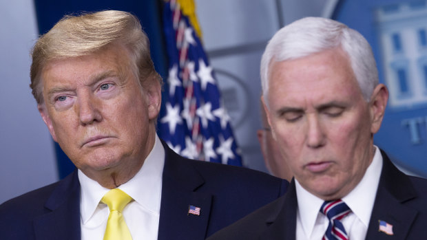 Donald Trump and his Vice-President, Mike Pence, at the news conference on Monday where the US President foreshadowed a "very dramatic" stimulus package.