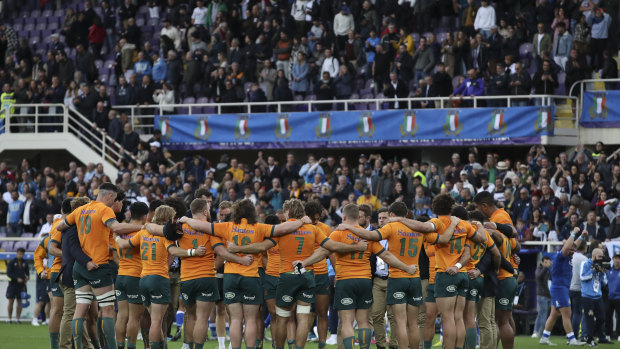 The Wallabies gather in a circle after losing to Italy in Florence.