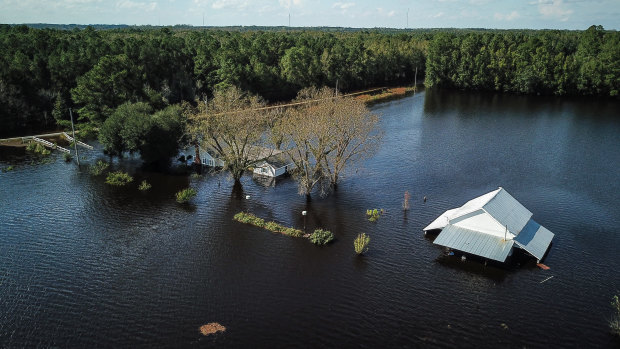 A flooded farm stands next to the Lumber River in this aerial photograph taken after Hurricane Florence hit Lumberton, North Carolina.