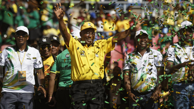 South Africa President Cyril Ramaphosa gestures to supporters after finishing his speech at his final election rally in Johannesburg on Sunday.