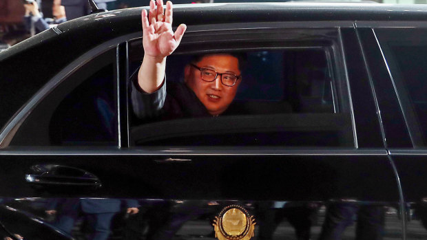 Kim Jong-un, North Korea's leader, waves from a limousine as he departs the inter-Korean summit at the village of Panmunjom in the Demilitarized Zone (DMZ) in Paju, South Korea in 2018.