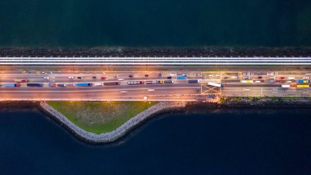 Vehicles travel along the Causeway across the Strait of Johor between Singapore and Malaysia.