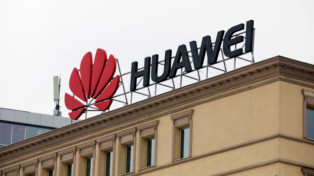 A sign advertises Huawei on a building on a city square in central Skopje, Macedonia.