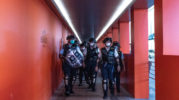 Hong Kong riot police patrol during a demonstration outside a shopping mall on May 10. 