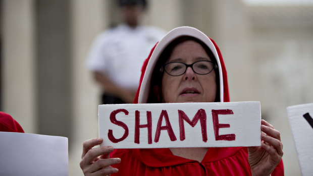 A demonstrator dressed in 'Handmaid's Tale' costume protests against the apparently pro-life US Supreme Court.