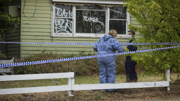 Forensics police outside the Grimshaw Street property in Bundoora on Friday.