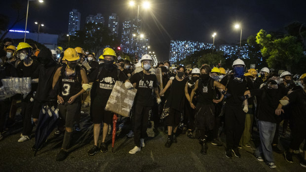 Demonstrators stand off against riot police during a protest in the Shatin district of Hong Kong on Sunday.