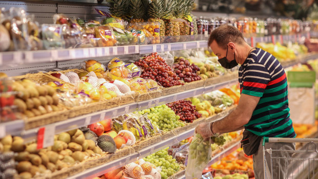 A customer shops for fresh fruit inside an Azbuka Vkusa OOO supermarket in Moscow, Russia, last week.
