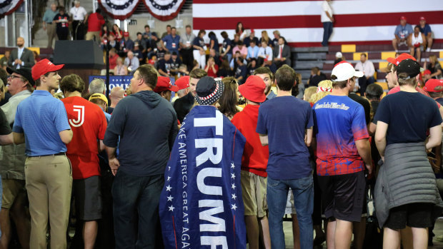 Attendees returned the attention Trump craved by answering his questions and chanting pre-election slogans.