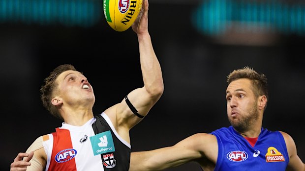 Gathering speed: St Kilda's Jack Billings controls the ball as Bulldog Matthew Suckling applies pressure.