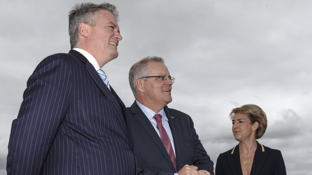 Prime Minister Scott Morrison, pictured on Monday with ministers Mathias Cormann and Michaelia Cash, has admitted handing $444 million to a private reef foundation without an open tender.