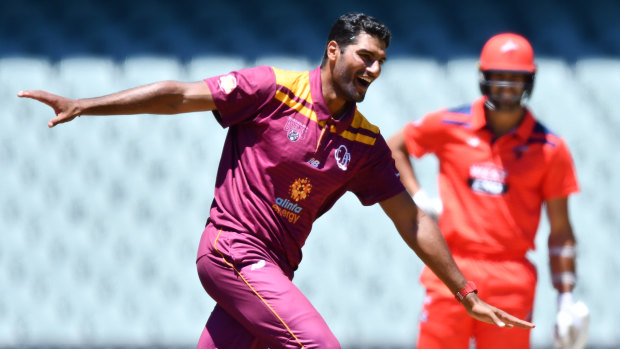 Gurinder Sandhu celebrates a wicket for Queensland against South Australia last month.