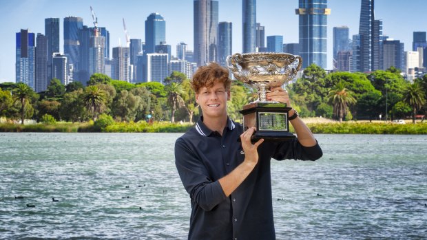 Jannik Sinner poses with the Norman Brookes Challenge Cup after winning the Australian Open men’s singles title.