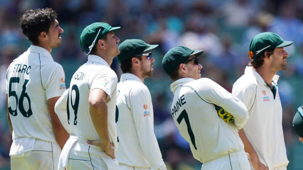 Screen time: Australian players watch the replays after an unsuccessful DRS review on day four of the Boxing Day Test at the MCG.