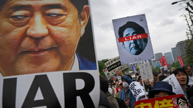 Demonstrators hold up signs reading "Liar" during a protest against Japan’s Prime Minister Shinzo Abe outside the National Diet building in Tokyo, Japan, on Saturday.