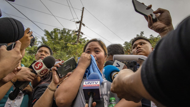 Jergin Dela Cruz Malabanan, daughter of Gina Dela Cruz, a radio reporter killed in the massacre, speaks to reporters before the verdict.