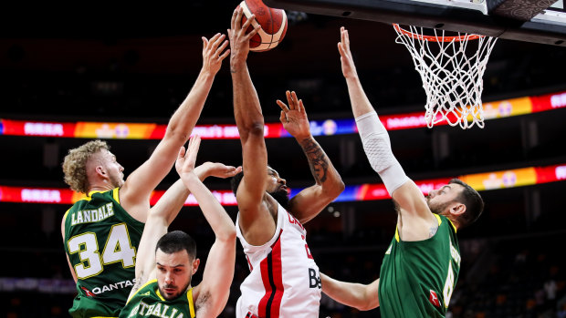 Rearguard action: Canada's Khem Birch drives to the basket.